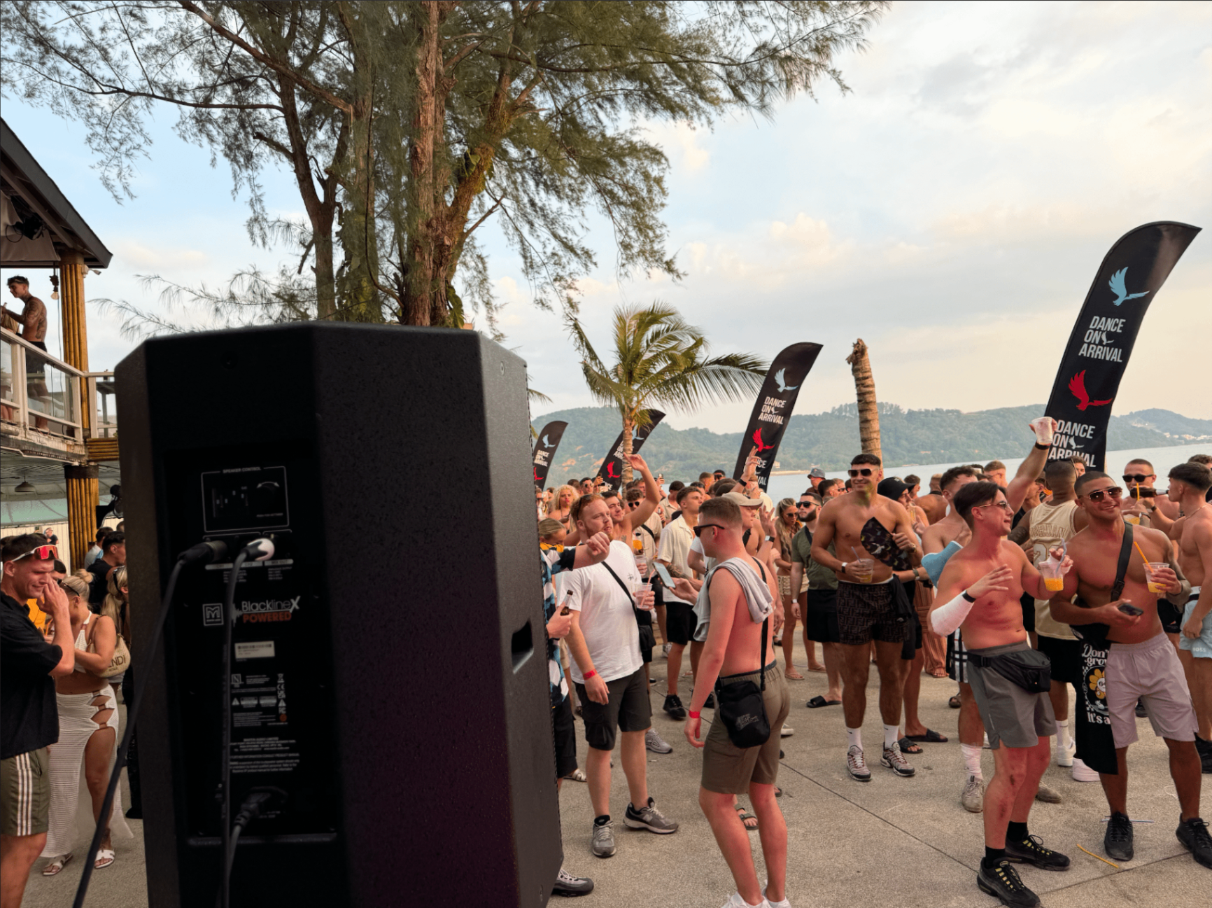 Daytime beach party in Phuket with Martin Audio Blackline speaker and crowd